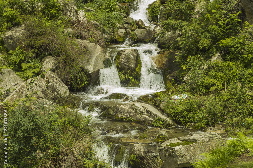 cascade of waterfalls in the forest among the stones cascade of waterfalls in the forest among the stones