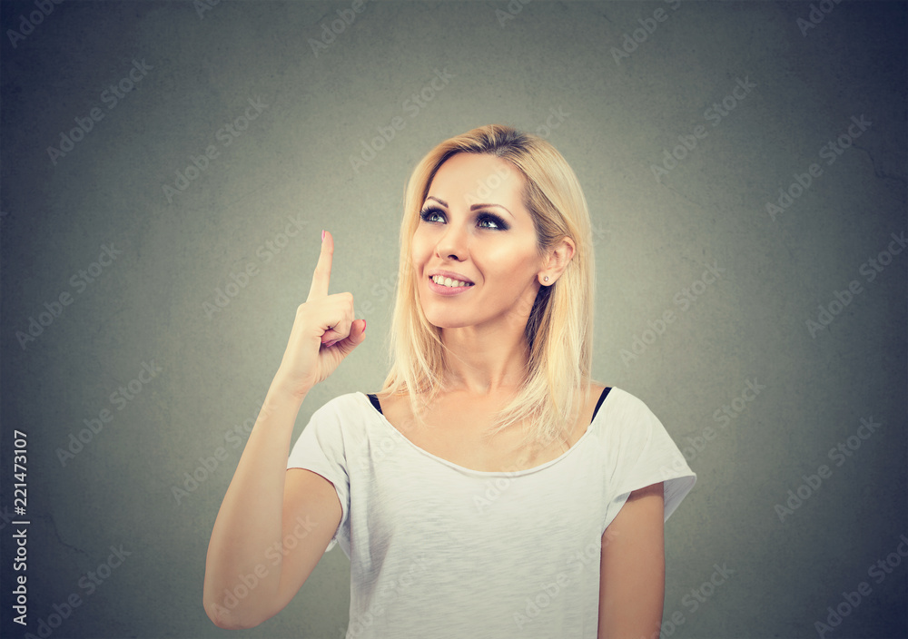 Casual woman pointing up has an idea Casual woman pointing up has an idea