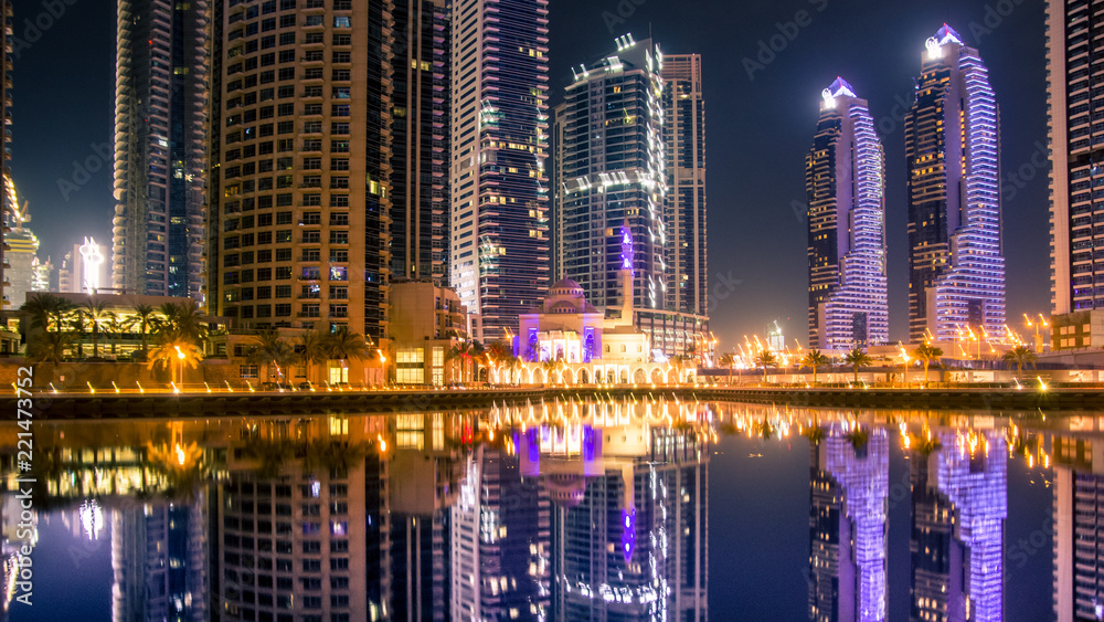 Fototapeta premium A view of a Mohammed Bin Ahmed Almulla Mosque. Night scene in the Dubai, Marina Dubai.