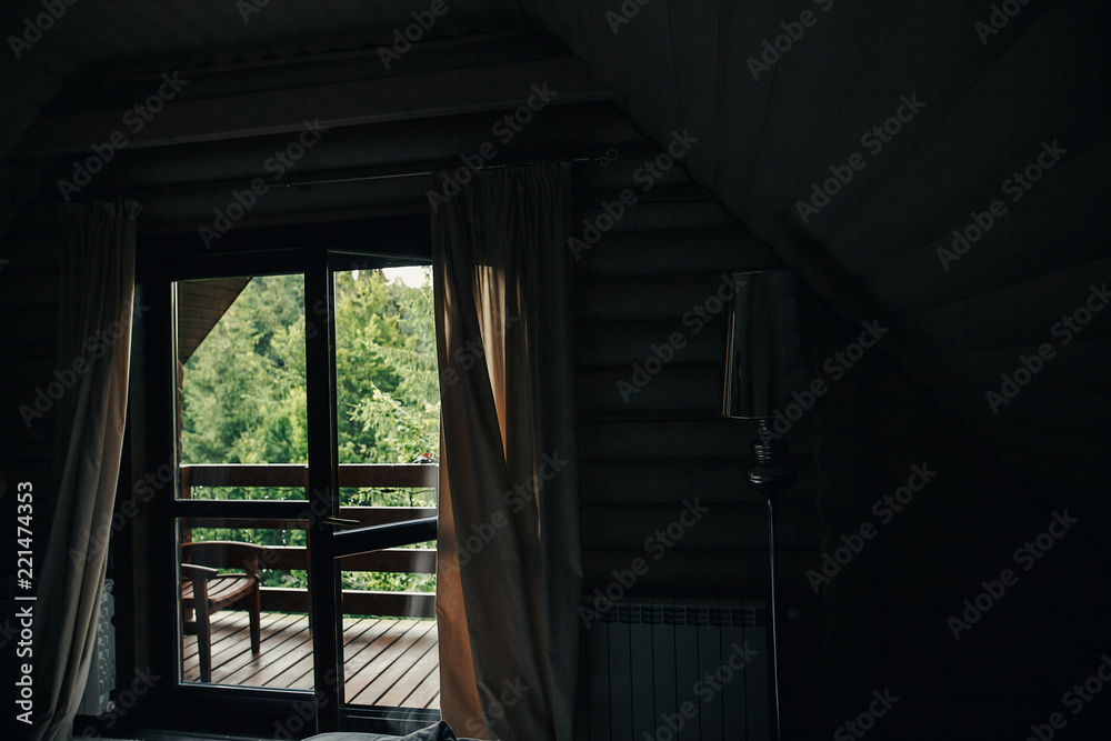 beautiful view from window on porch on trees in woods. cottage balcony with view on forest in mountains. atmospheric moment. summer vacation. rural country relax time beautiful view from window on porch on trees in woods. cottage balcony with view on forest in mountains. atmospheric moment. summer vacation. rural country relax time