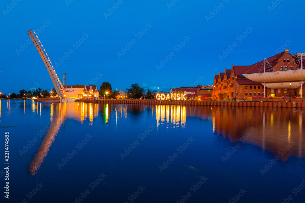 Gdansk, Poland - August 18, 2018: Gdansk (Danzig) at night with reflection in Motlawa river, Poland