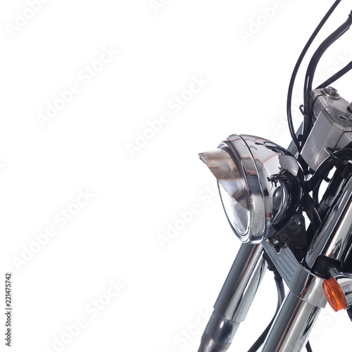 Close up of headlight on vintage motorcycle on white background