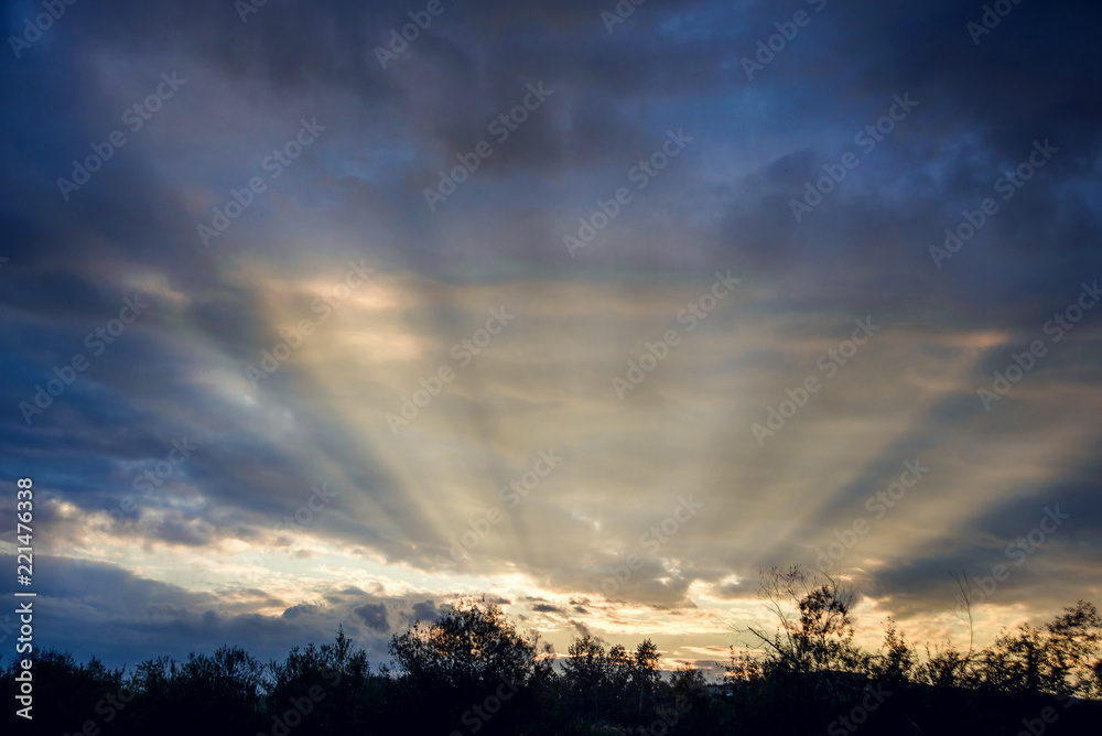 A unique natural phenomenon: sunset, the sun's rays illuminate the sky A unique natural phenomenon: sunset, the sun's rays illuminate the sky