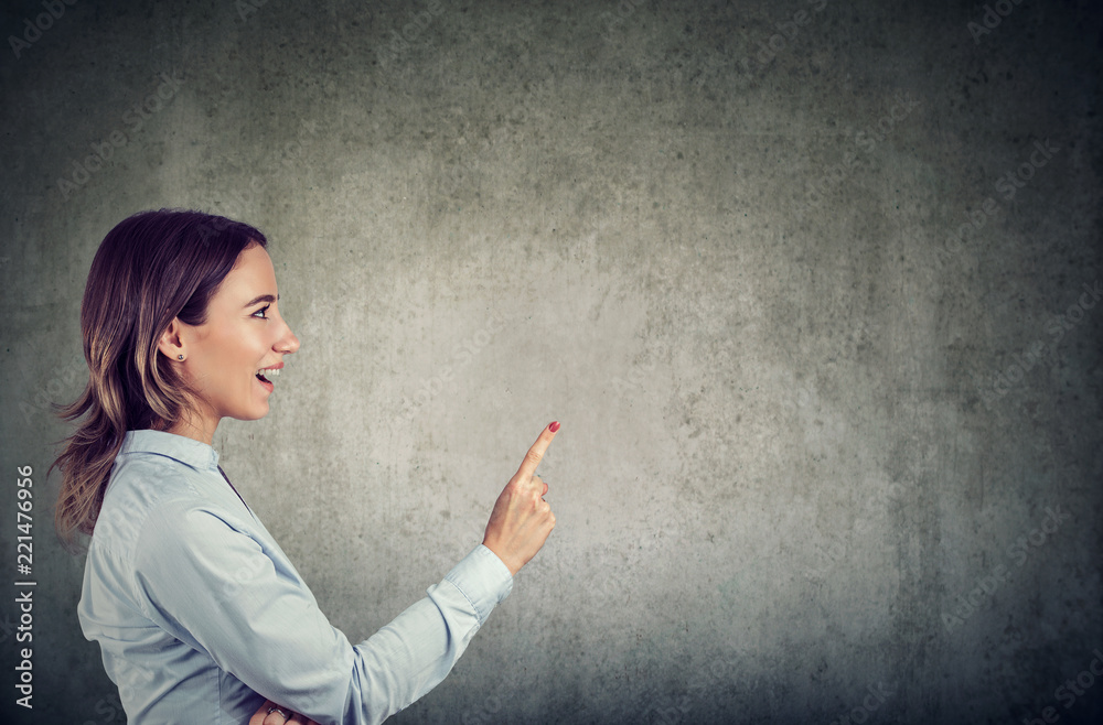 Casual woman pointing up has an idea Casual woman pointing up has an idea