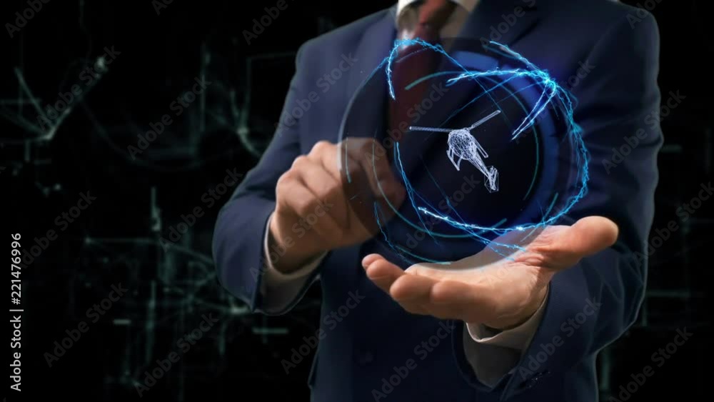 Businessman shows concept hologram 3d helicopter on his hand. Man in business suit with future technology screen and modern cosmic background Businessman shows concept hologram 3d helicopter on his hand. Man in business suit with future technology screen and modern cosmic background