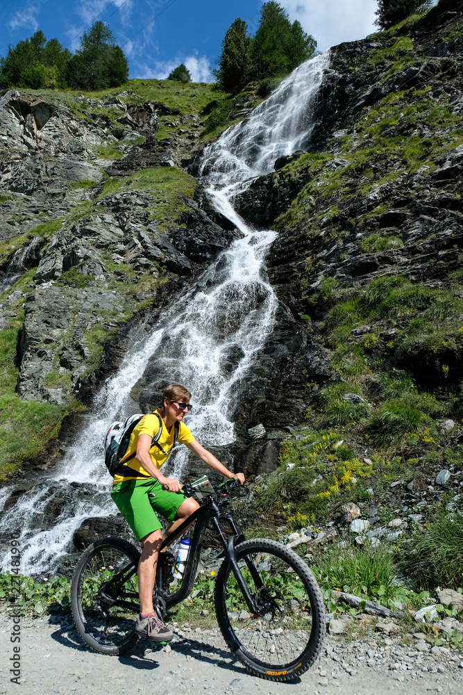 Fototapeta premium mountainbiker in action in the beautiful aosta valley, Italy, Europe