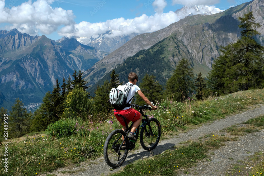 mountainbiker in action in the beautiful aosta valley, Italy, Europe mountainbiker in action in the beautiful aosta valley, Italy, Europe