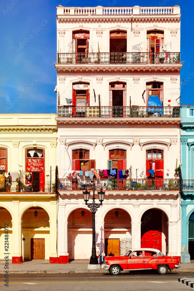 Old car and colorful buildings in downtown Havana