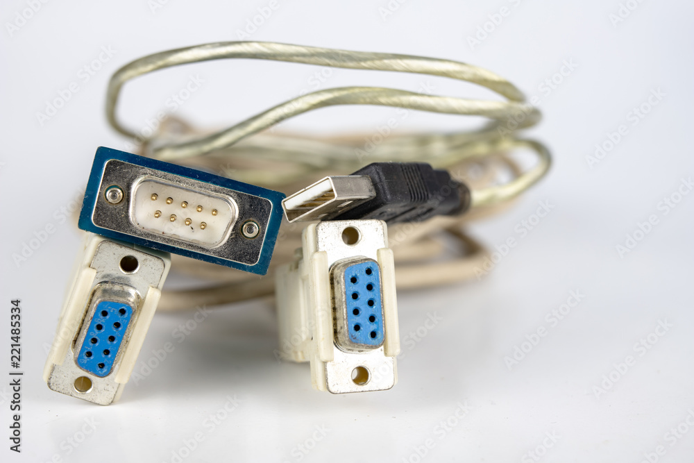 Old PC cables on a white table .. Com and lpt connectors for old computer stations. Old PC cables on a white table .. Com and lpt connectors for old computer stations.