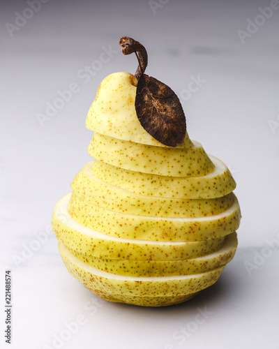 yellow ripe pear on a marble table
