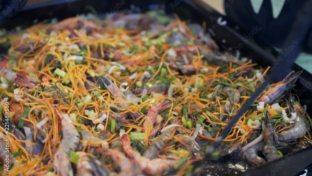 shrimp with vegetables stewed in a pan. shrimp with vegetables stewed in a pan.