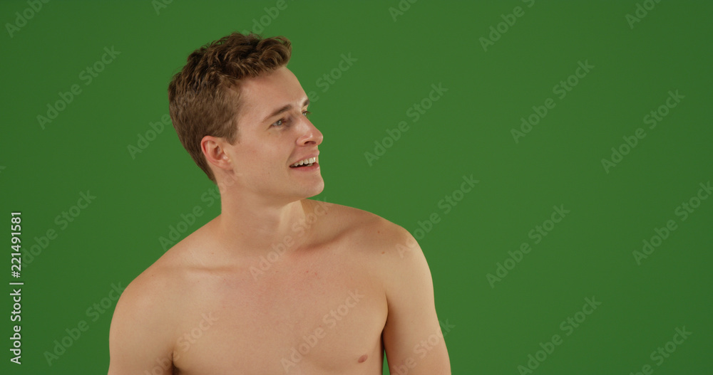 Handsome white male looking offscreen shirtless on green screen Handsome white male looking offscreen shirtless on green screen