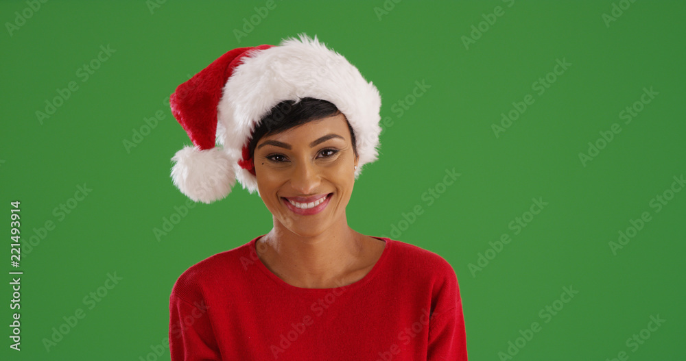 Smiling African-American woman in Christmas attire on green screen Smiling African-American woman in Christmas attire on green screen