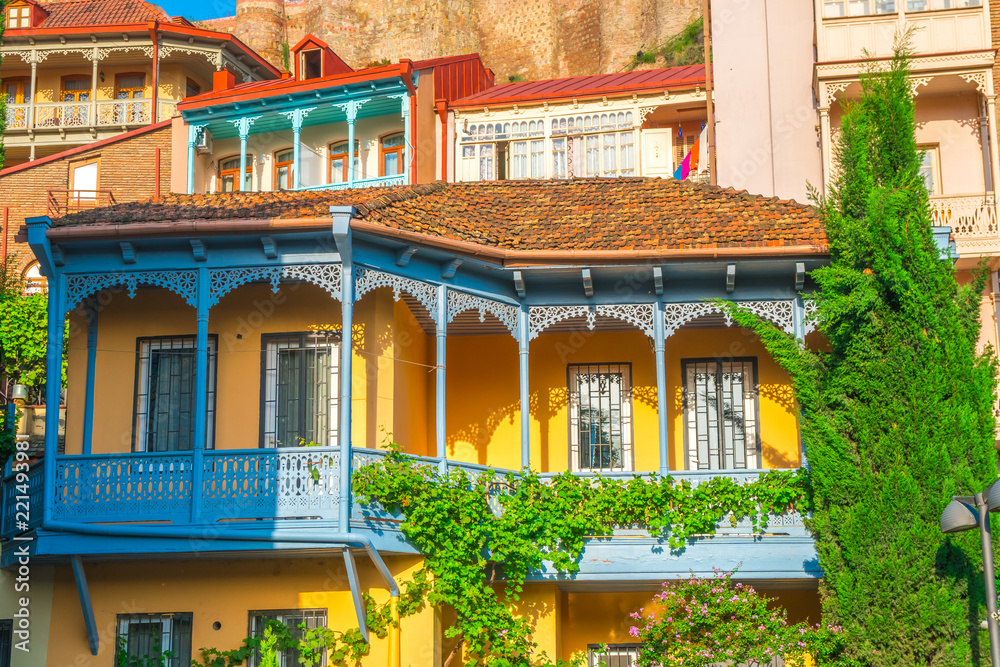 Colorful traditional houses with wooden carved balconies in Abanotubani district of old town Tbilisi, Georgia