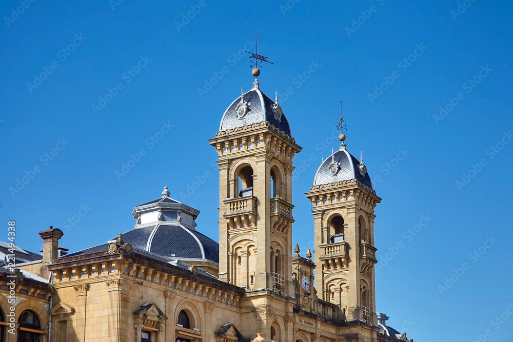 San Sebastian (Donostia), Basque country, Spain: Fragment of the facade of The City Hall building on blue sky background