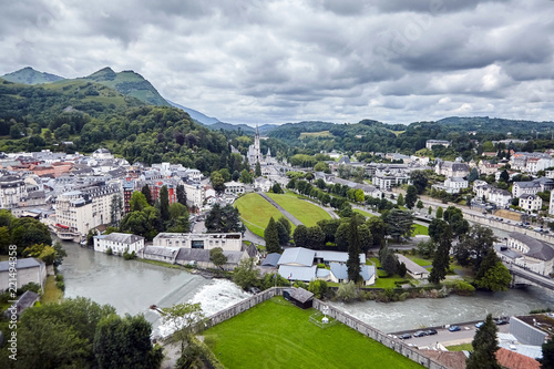 The Sanctuary of Our Lady of Lourdes or the Domain and river Gave de Pau. The Hautes-Pyrenees department in the Occitanie region in south-western France