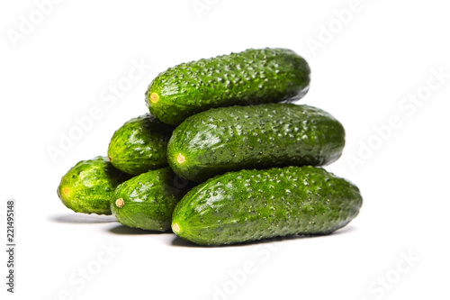 Heap of fresh green Cucumbers isolated on white background