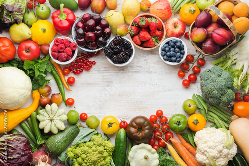 Fototapeta Naklejka Na Ścianę i Meble -  Healthy summer fruits vegetables berries arranged in a frame, cherries peaches strawberries cabbage broccoli cauliflower squash tomatoes carrots beetroot, copy space, top view, selective focus