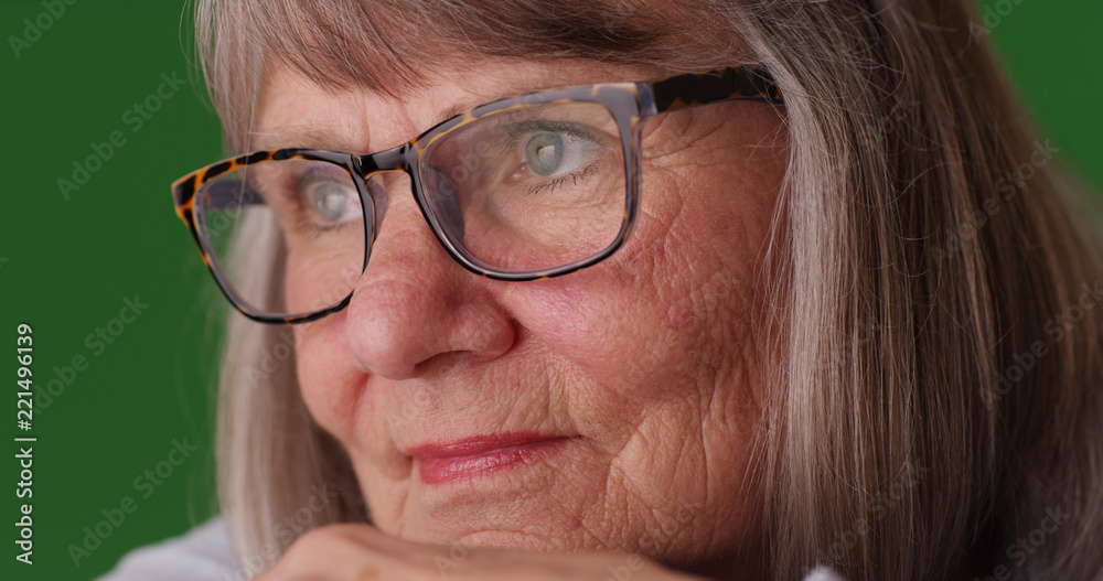 Close-up shot of pensive white elderly lady thinking to herself on green screen Close-up shot of pensive white elderly lady thinking to herself on green screen