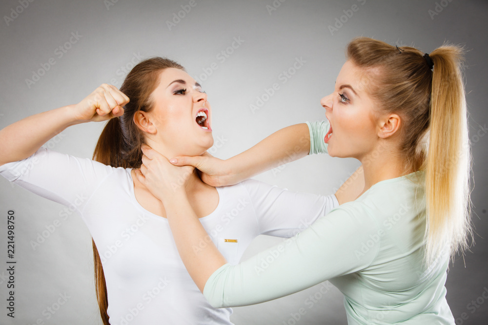 Two agressive women having argue fight
