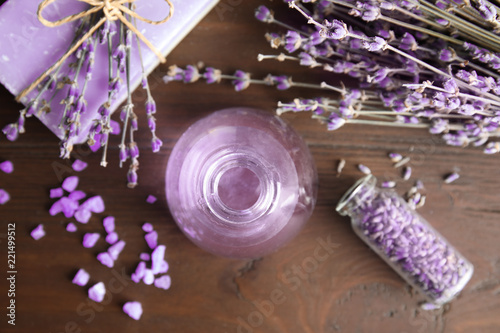 Fototapeta Naklejka Na Ścianę i Meble -  Flat lay composition with aromatic lavender oil on wooden background