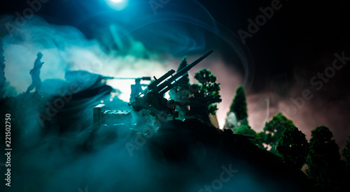 War Concept. Military silhouettes fighting scene on war fog sky background, World War Soldiers Silhouettes Below Cloudy Skyline At night. Attack scene. Selective focus Tanks battle. Decoration © zef art