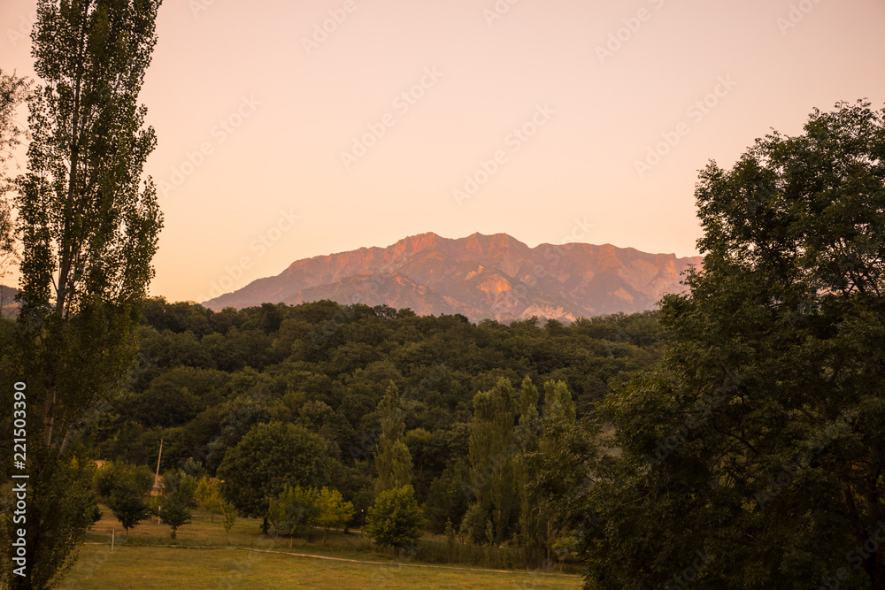 Majestic landscape of the mountains and forest in Caucasus at summer. Dramatic sky with clouds. Majestic landscape of the mountains and forest in Caucasus at summer. Dramatic sky with clouds.