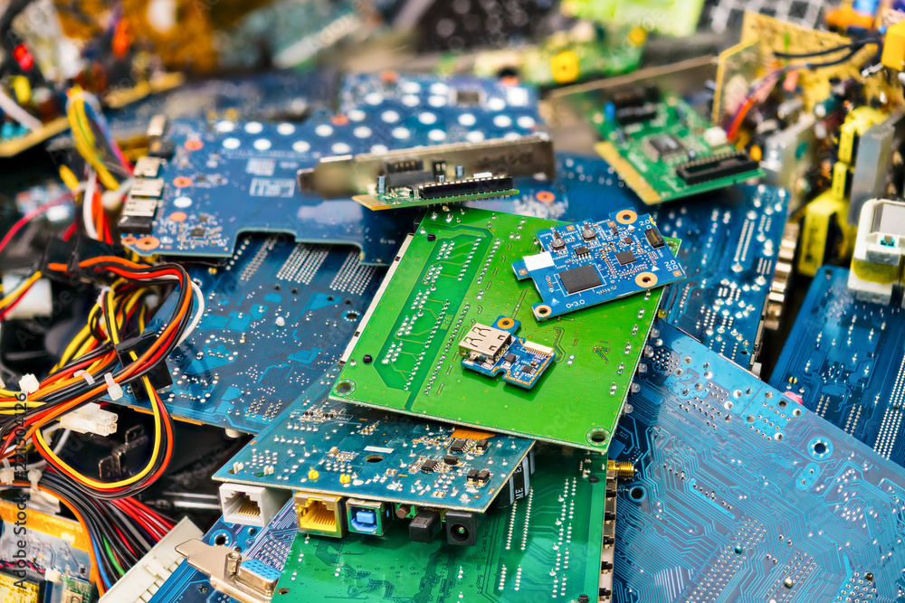 E-waste heap from discarded laptop parts. Connectors, PCB, notebook cards.  Colorful blurry background from PC components. Idea of electronics  industry, eco, sorting and disposal of electronic waste. Stock Photo |  Adobe Stock