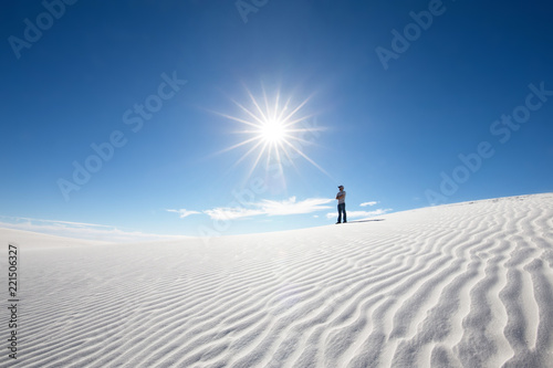 Man in solitude in desert photo