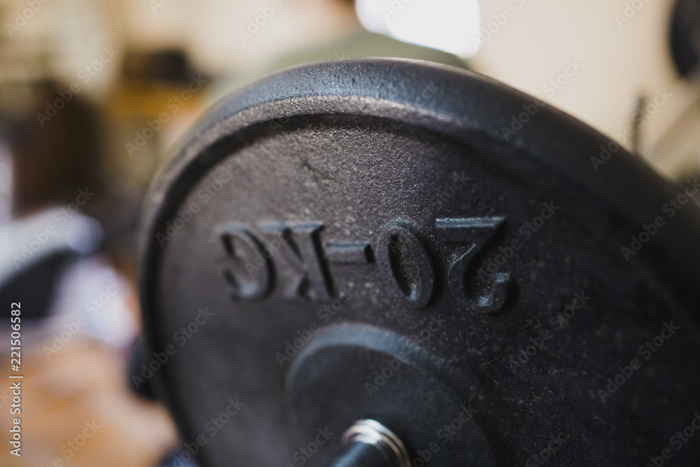 Fototapeta premium dumbbell 20 kilograms to stay fit young and strong in a gym.