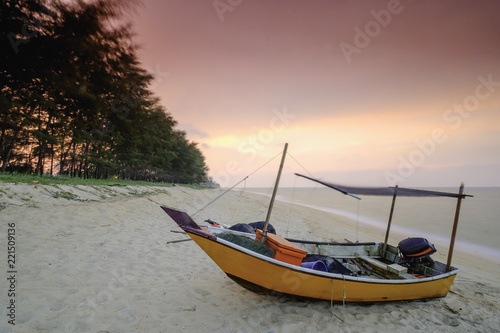 Fishing boats  is parked on the beach during beautiful sunset  at Kampung Mangkuk  Terengganu  Malaysia