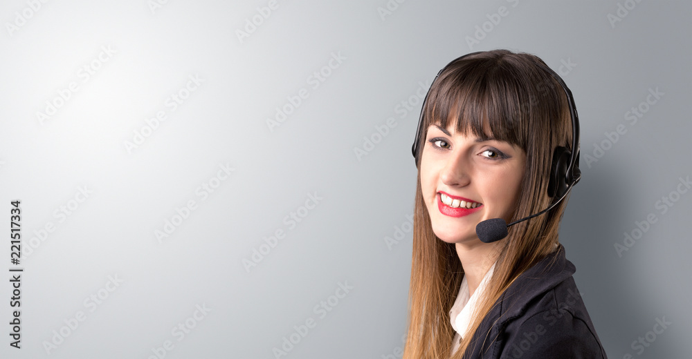 Young female telemarketer on a white background Young female telemarketer on a white background
