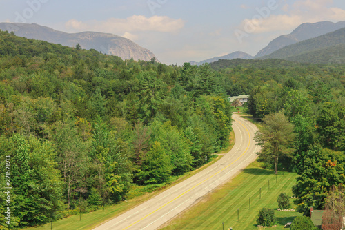 A summer scenic view of the white mountains and national forest in New Hampshire  taken as a drone picture from above of the beautiful scenery and nature. This background is beautiful.