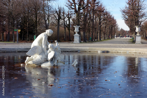 Frozen fountain with an sculpture in sch?nbrunn park in Vienna photo