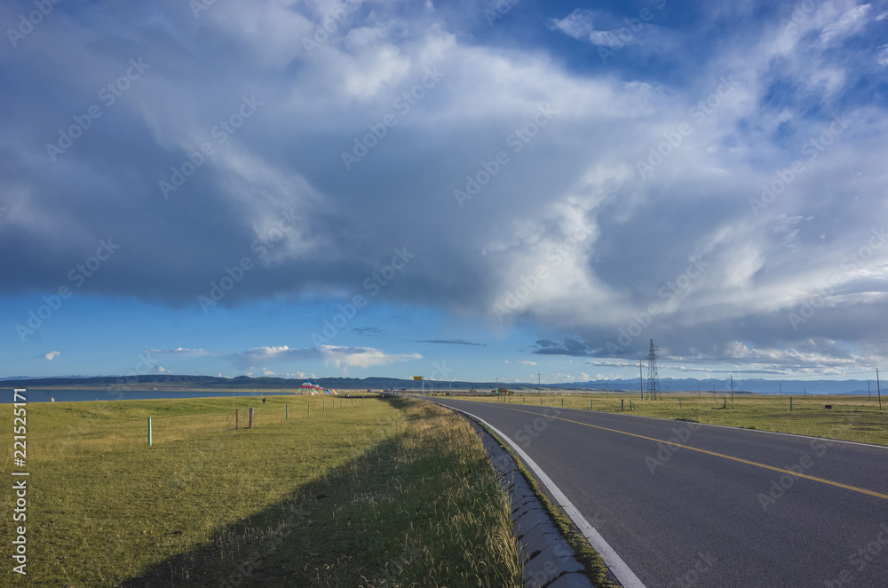 Road leading to background near Qinghai Lake, China