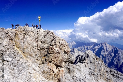 climber on top of the mountain  Zugspitze  in germany