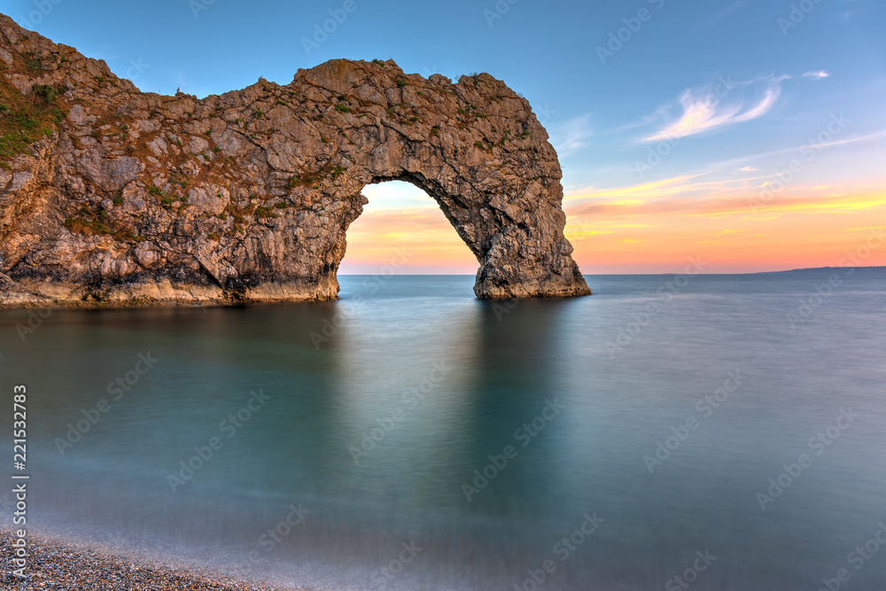 Fototapeta The Durdle Door, part of the Jurassic Coast in southern England, after sunset