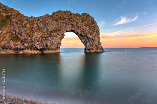 The Durdle Door, part of the Jurassic Coast in southern England, after sunset