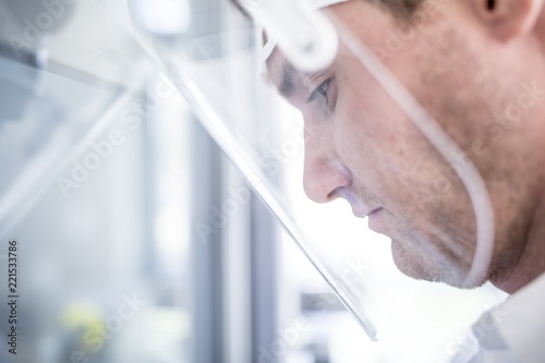 Lab technician wearing face shield photo