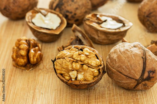 Healthy food safety concept:Walnuts kernels on dark desk with color background