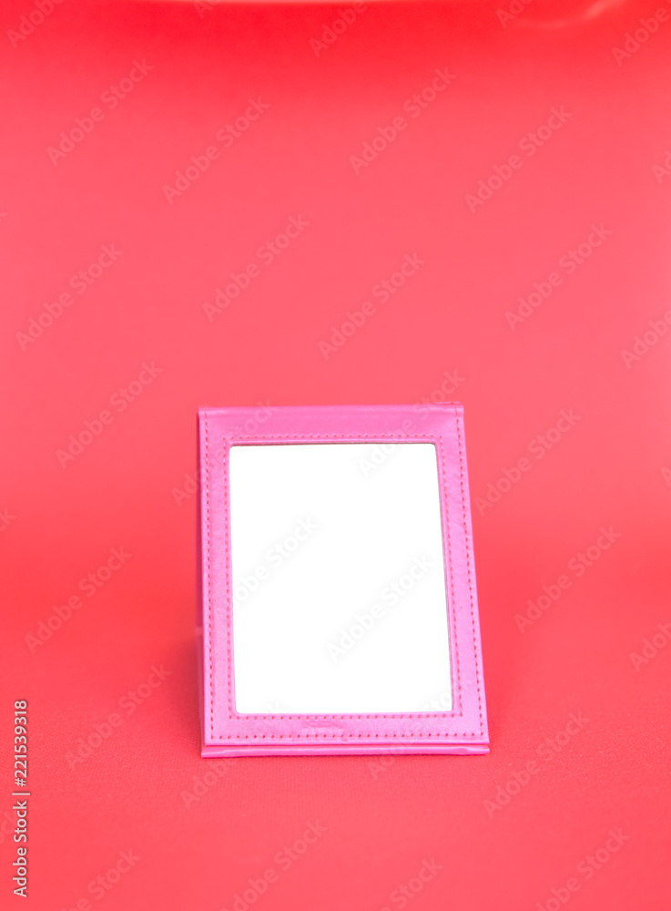 the mirror in a pink frame on a pink background
the mirror in a pink frame on a pink background