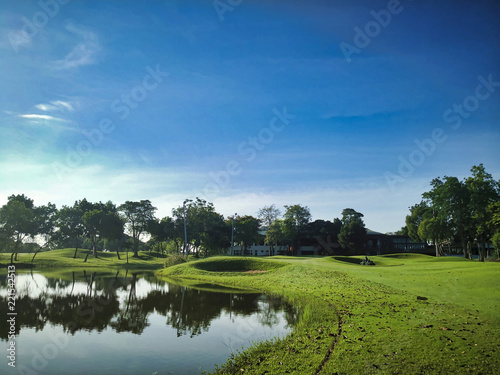 landscape with green field and blue sky © GODLANDTURE