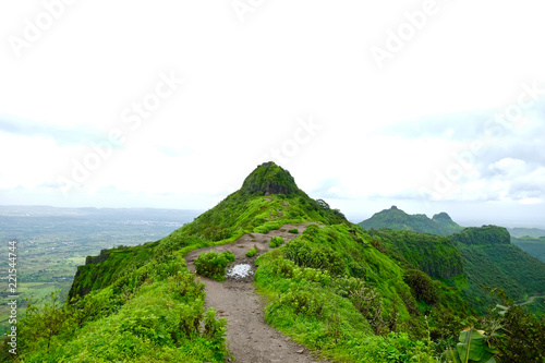 Beautiful landscape aerial  and closeup Photos of nature  roads  grass  trees  village  and farm land. Lush green monsoon nature mountains  hills  Purandar fort  Pune  Maharashtra  India