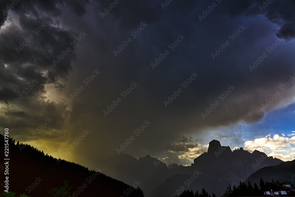 Storm clouds and downpour in mountains