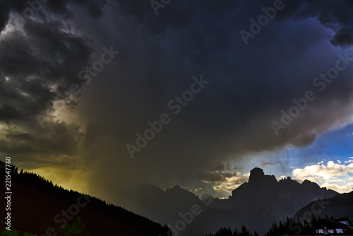 Storm clouds and downpour in mountains
