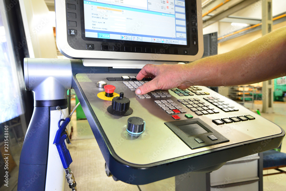 The control panel of the program of work on the control panel of the precision CNC machining center, the processing of the manufacturing process of the metal product at the factory. The control panel of the program of work on the control panel of the precision CNC machining center, the processing of the manufacturing process of the metal product at the factory.