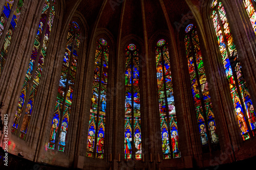 Colorful stained glass windows in the apse of the cathedral of Saint-Fulcran in Lodeve, France