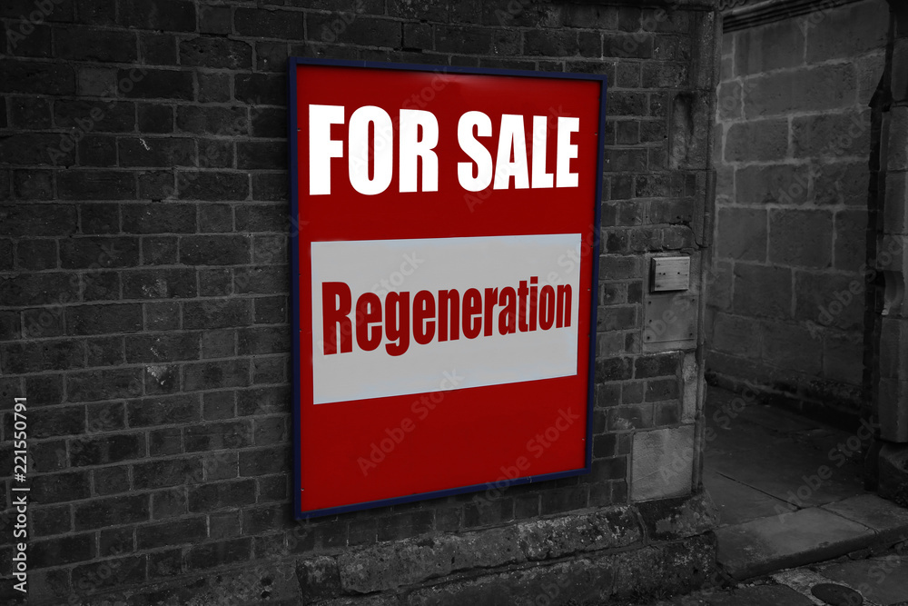 Fototapeta premium For sale with regeneration written on a sign attached to a brick wall with selective colour