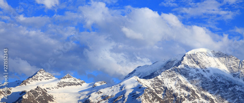snow-covered peaks and clouds © Dim154