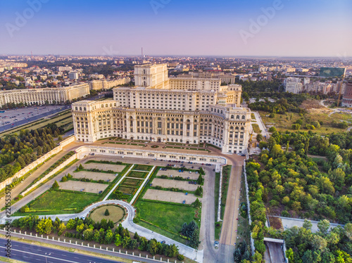 Parliament building or People's House in Bucharest city. Aerial view at sunset with blue sky
